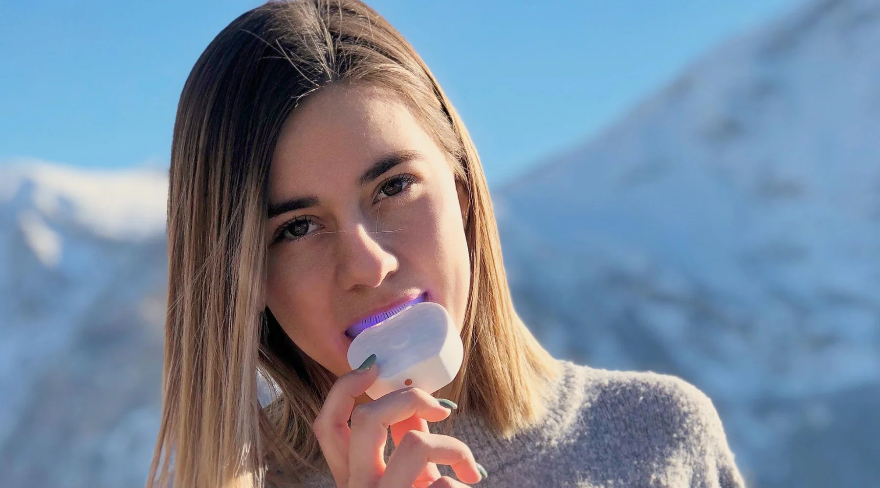 Woman using Orybrush in beautiful mountain setting